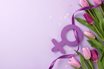 Symbols of strength: honoring Women's history in This special month. Top view shot of female gender symbol, lilac ribbon, fresh tulips, confetti on purple background with greeting space