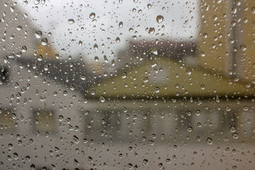 rainy day outside with raindrops in the window
