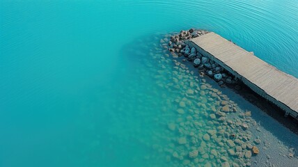 Wooden pier on crystal-clear blue lake