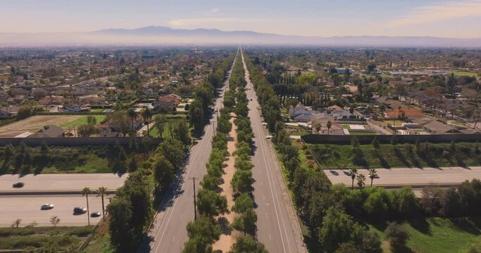 Euclid Ave Tree Lined Bridge over freeway in Ontario, California