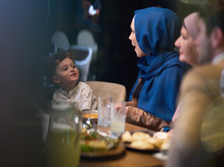 In a heartwarming scene, a professional chef serves an European Muslim family their iftar meal during the holy month of Ramadan, embodying cultural unity and culinary hospitality in a moment of shared