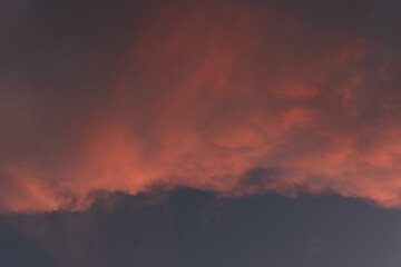 Orange Sunset background with different textures and colors in the clouds.