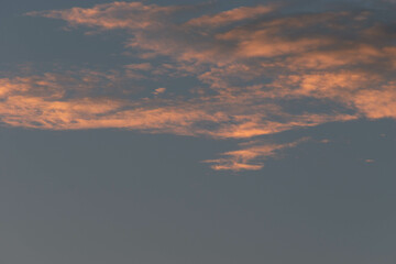 Orange Sunset background with different textures and colors in the clouds.