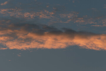 Orange Sunset background with different textures and colors in the clouds.