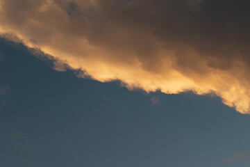 Orange Sunset background with different textures and colors in the clouds.