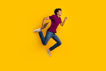 Fototapeta na wymiar Profile side photo of cheerful nice man wear trendy polo running hurrying sale empty space isolated on yellow color background