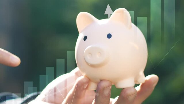 Finance and business concept. Concept of savings and investments . Piggy bank closeup with growth arrows and icons.Investment graph and rows growth of coins. Concept of investing 