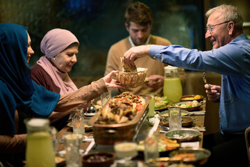 Fototapeta na wymiar A modern and traditional European Islamic family comes together for iftar in a contemporary restaurant during the Ramadan fasting period, embodying cultural harmony and familial unity amidst a