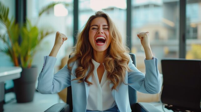 A beautiful young woman sits on a chair, screams, clenches her fists, delighted at the rapid success of an investment business.