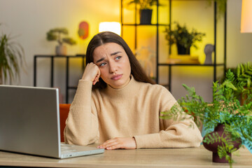 Portrait of sad woman looks pensive thinks over life concerns or unrequited love, suffers from...