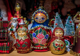 Colorful Christmas ornaments and traditional Russian matryoshka nesting dolls for sale, a souvenir shop in the old town, Colmar, France