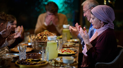 In a modern restaurant setting, a European Islamic family comes together for iftar during Ramadan,...