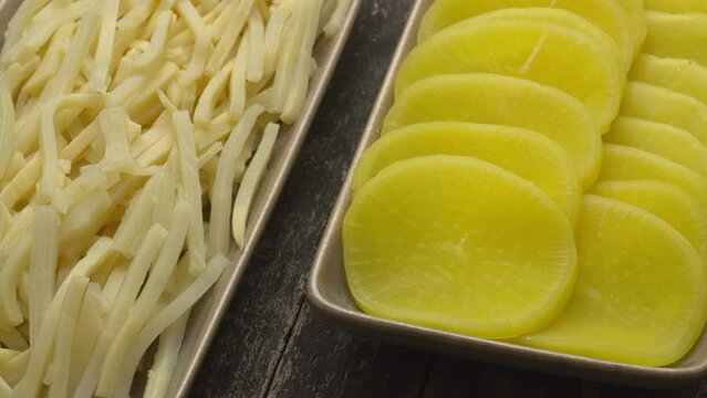 Asian style pickle: turmeric pickled daikon (takuan) and bamboo shoots. Table spin.