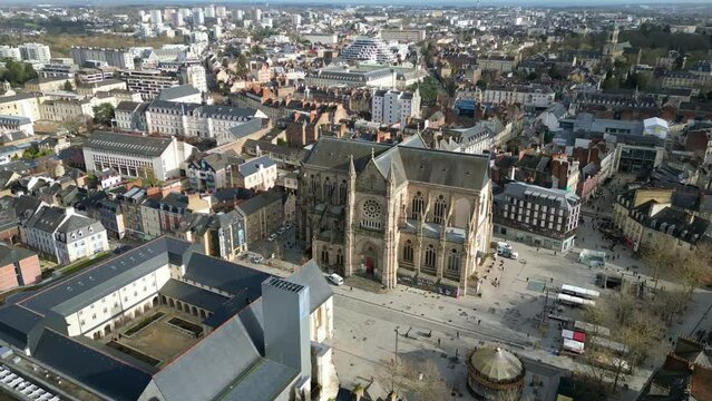 Basilica Saint-Aubin in Place Sainte Anne square and Jacobins convent, Rennes in France.Aerial tilt down forward