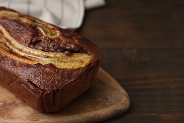 Delicious banana bread on wooden table, closeup. Space for text