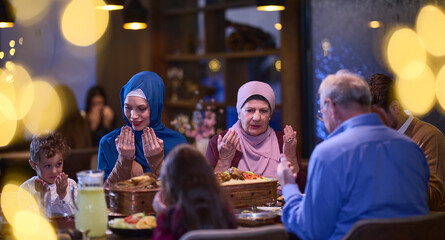 In a modern restaurant setting, a European Islamic family comes together for iftar during Ramadan,...
