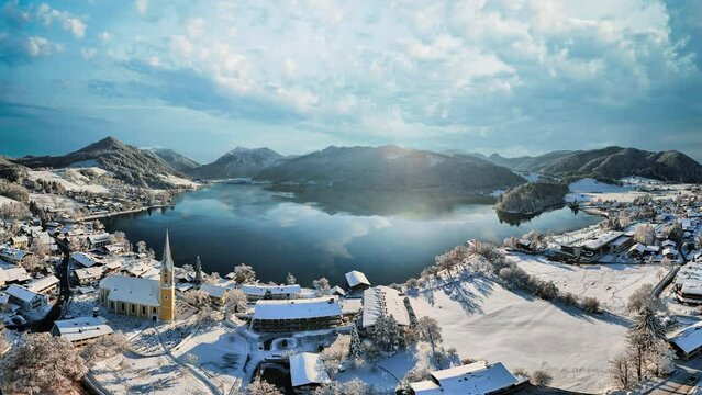Lake Schliersee in Bavaria. Cinemagraph seamless loop time lapse. Winter landscape, white snow, alps mountains.