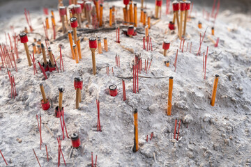 Incense stick are burning in an incense pot at Chinese temples. Many burning incense are in incense...