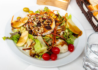 Tasty salad with goat cheese, nuts and apples. Spanish cuisine