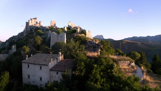 drone panorama of the hill of forte calascio abruzzo italy on sunset