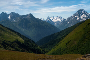 Obraz premium View of the peaks of the North Caucasus mountains near the Arkhyz ski resort on a sunny summer day, Karachay-Cherkessia, Russia