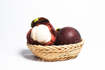 Mangosteen, an exotic asian fruit isolated on white background