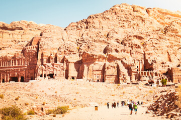 Tourists walk visit Petra historical landmark in Jordan on summer with scenic panorama of sacred...