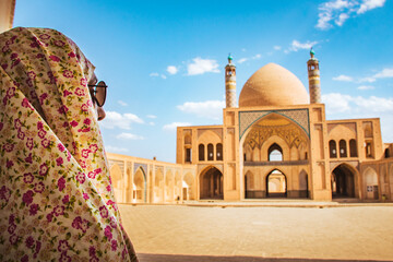 Kashan, Iran - 29th may, 2022: Tourists and pilgrims explore sightseeing beautiful Agha Bozorg...