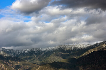 San Gabriel Mountains, looking north from Pasadena, shown during an early February 2024 storm that brought rain and snow to Southern California. 
