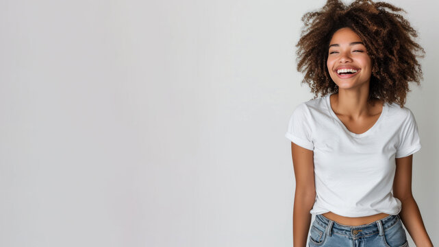 Afro woman wear white t-shirt smile isolated on grey background