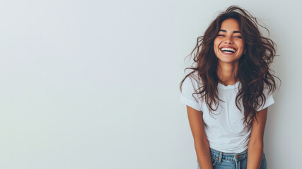 Indian woman wear white t-shirt smile isolated on grey background - Powered by Adobe