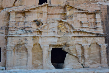 Entrance to a tomb carved into the rock in the Hegra archaeological park of the city of Petra, Wadi...