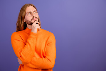 Photo of handsome confident man wear eyeglasses touch chin looking empty space planning his costs...
