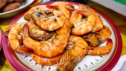Grilled shrimp with sauce on a plate