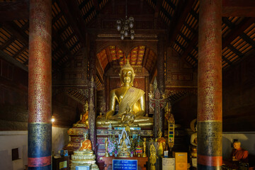 Golden Buddha statue in temple interior