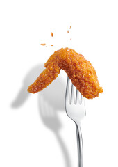 Delicious hot crispy fried chicken on a fork isolated on white ackground. Korean fried chicken