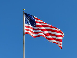 American flag waving proudly against a blue sky with stars and stripes, symbolizing freedom and patriotism in the United States
