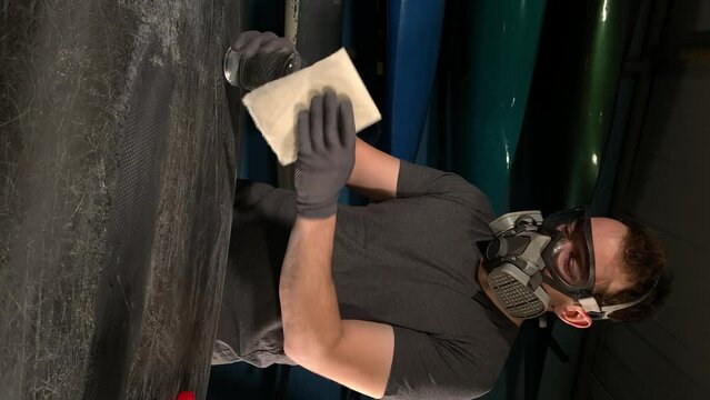 repair the boat. canoe repair. degrease the surface. vertical video. slow motion video. High-quality 4K shooting