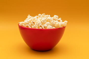 National Popcorn Lover's Day. Popcorn in Red Bowl on Yellow Background. Movie, Cinema. Greeting...