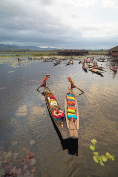 Damnoen Saduak Floating Market or Amphawa. Local people sell fruits, traditional food on boats in canal, Ratchaburi District, Thailand. Famous Asian tourist attraction destination. Festival in Asia.