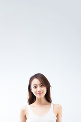 Adorable young girl clad in snug vest undergarments, showcasing her style against a pristine white background. Generative AI.