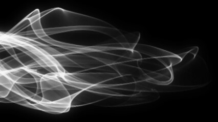 Abstract white smoke swirls with blur on black background.