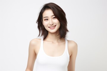 Sweet little girl donning comfy vest lingerie, posing with confidence on a clean white surface. Generative AI.