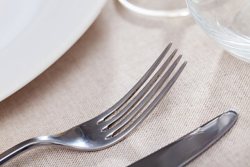 Clean fork served on table with cutlery in restaurant