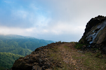 Fototapeta na wymiar On the edge of mountain trail have a great view in Jinguashi, New Taipei City, Taiwan.