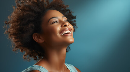 Smiling dreamy beautiful black woman.Curly hair in afro style