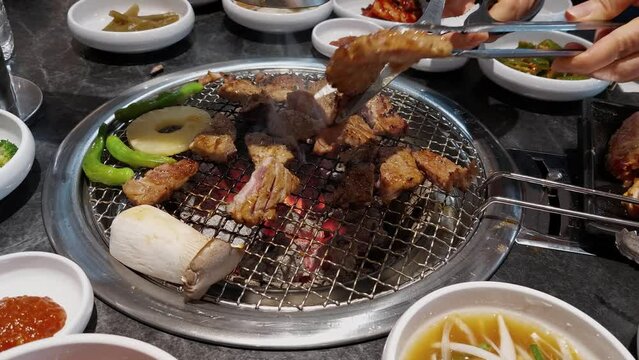 Korean BBQ Marinated Pork Ribs Grilled Over Charcoal Grill