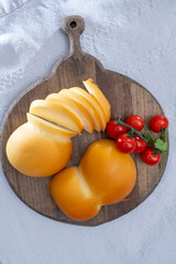 Cheese collection, Italian cheese scamorza, caciocavallo, provolone made from cow milk in South Italy yellow smoked cheese