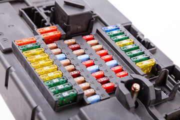 Automotive fuses box in different colors and each color is responsible for the specific value of...