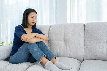 Depression and mental illness. Asian woman disappointed, sad after receiving bad news. Stressed girl confused with unhappy problems, arguing with boyfriend, cry and worry about unexpected pregnancy